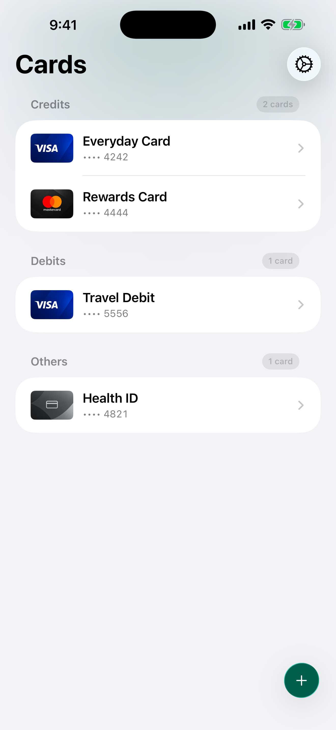 Holder home screen showing four sample cards: Everyday Card, Rewards Card, Travel Debit, and Health ID.